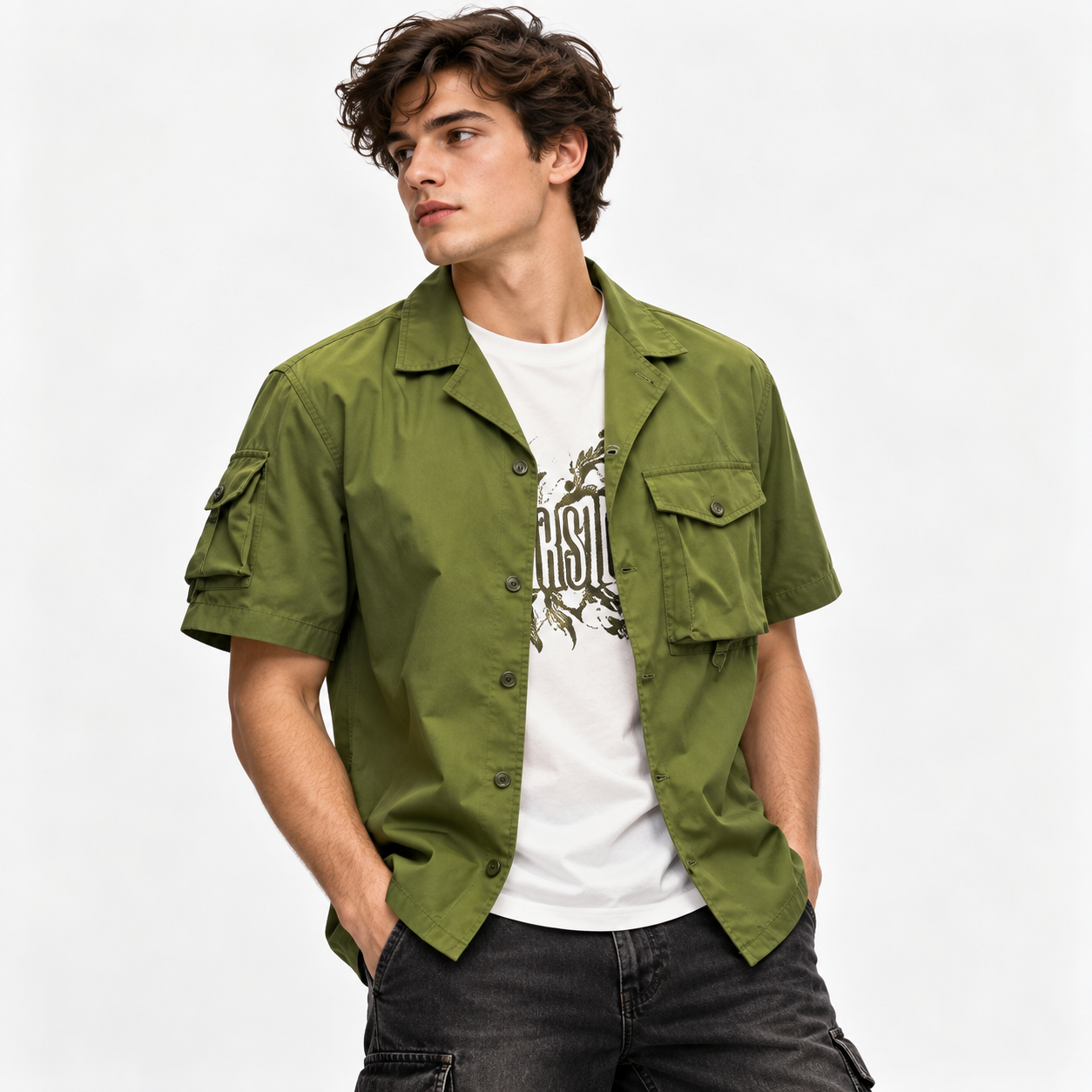 Man in olive overshirt and dark trousers