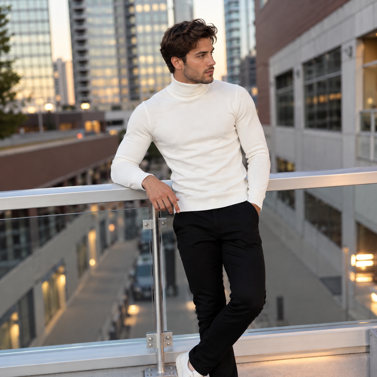 Man in a cream sweater in an urban setting